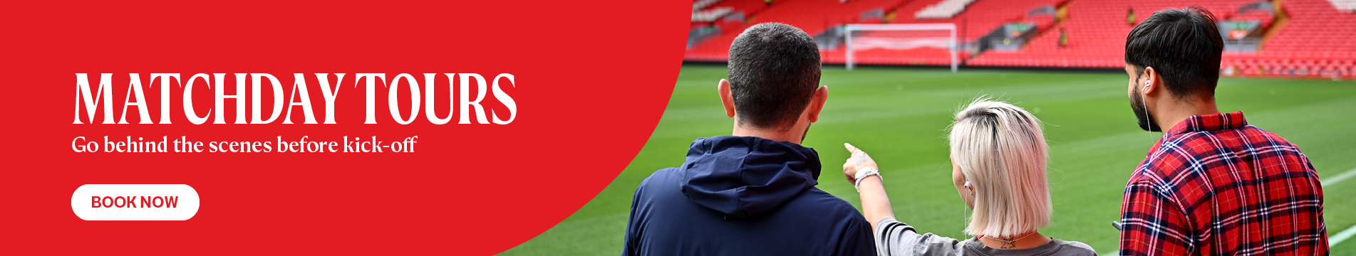 Red graphic background with white lettering ‘THE ANFIELD ABSEIL’. An abseiler graphic and stadium wall in view behind. 