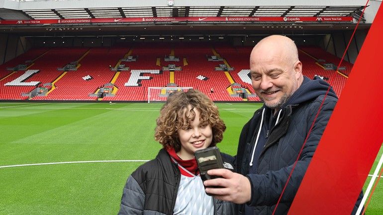Father and son taking a selfie on the pitch