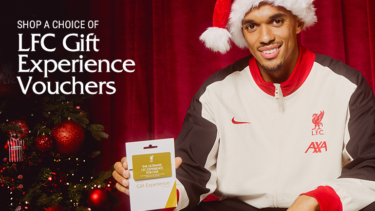 Trent in a santa hat with gift voucher