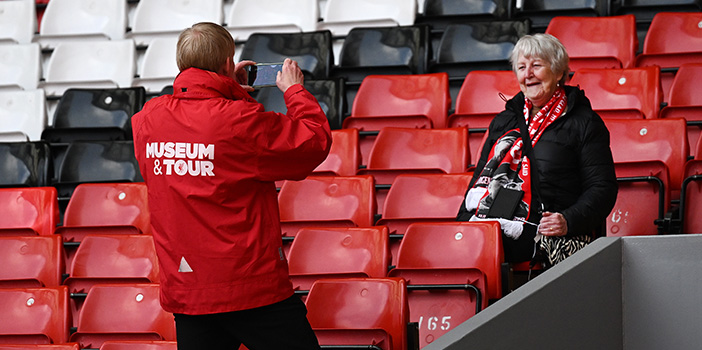 Fan having photo taken in the stands
