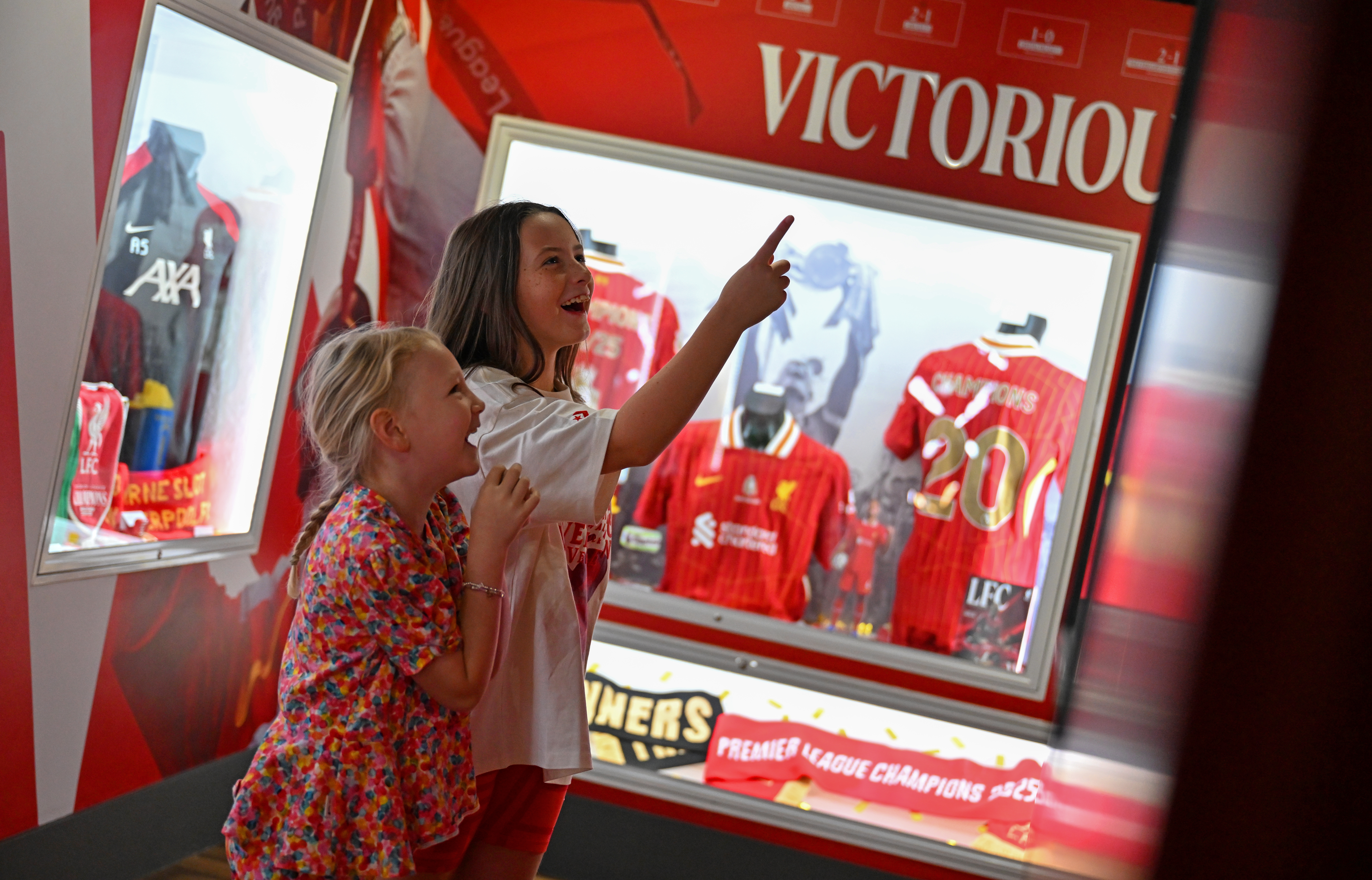 Lettering âThe Bossâ on the wall of the LFC Museum with Arne Slot display case in shot