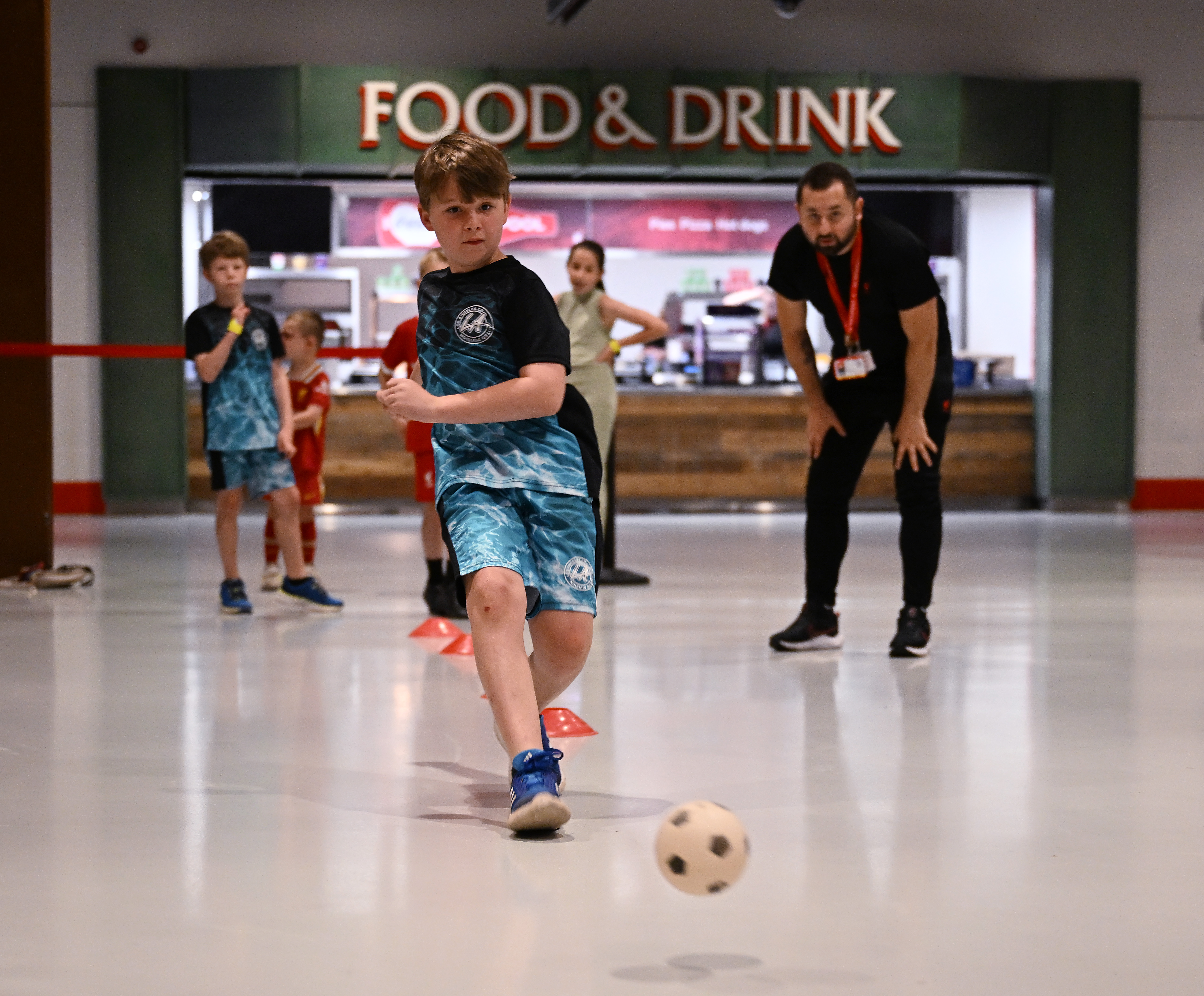 Some young fans playing football